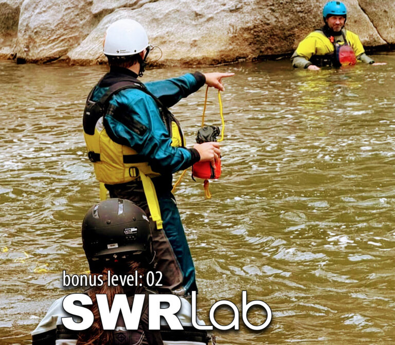 A certified swiftwater rescue instructor teaches a student how to safely get a kayaker across the waterduring the Level Up Kayak School Swiftwater Rescue Lab course.