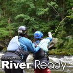 A certified swiftwater rescue instructor teaches a student how to use a throw bag safely during the Level Up River Ready course.