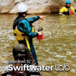 A certified swiftwater rescue instructor teaches a student how to safely get a kayaker across the waterduring the Level Up Kayak School Swiftwater Rescue Lab course.
